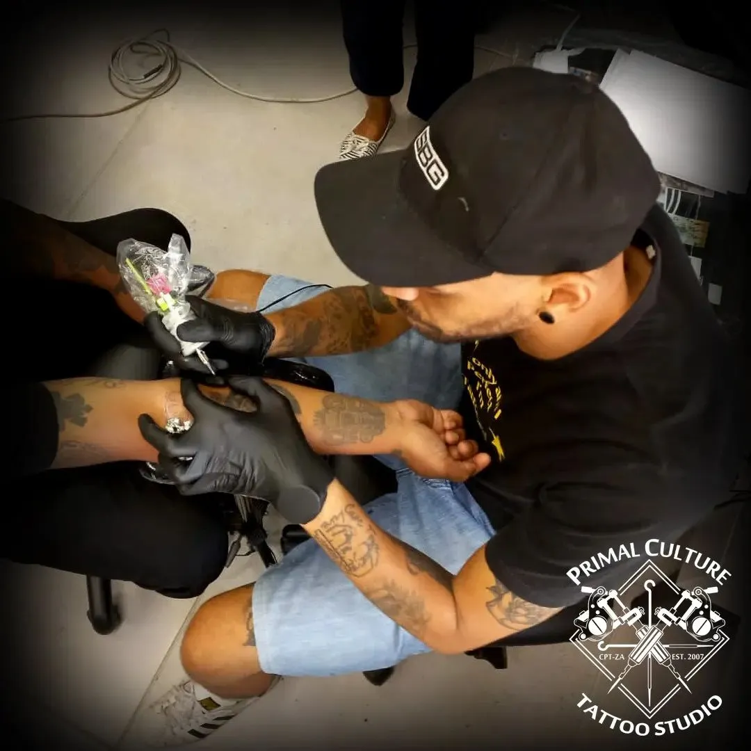 Primal Culture - Lee with a forearm tattoo